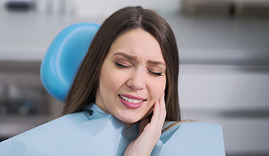 Woman in dental chair with toothache