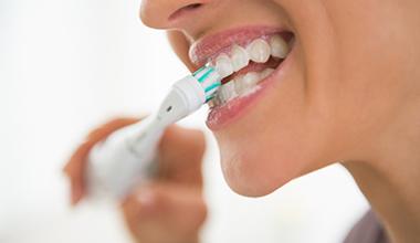 Woman brushing her teeth