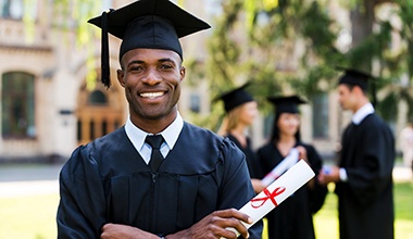 Man wearing a cap and gown