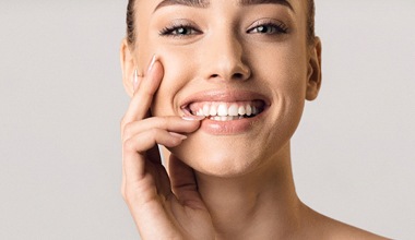 Woman with healthy gums smiling