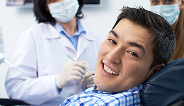 smiling man in blue shirt