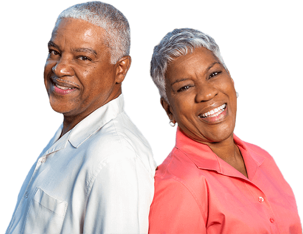 Smiling man and woman standing back-to-back