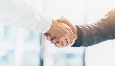 two men shaking hands