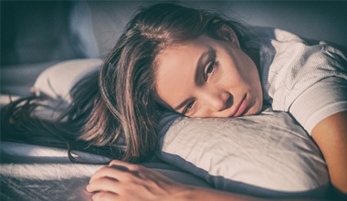 Woman laying in bed awake due to sleep apnea in Worthington, PA