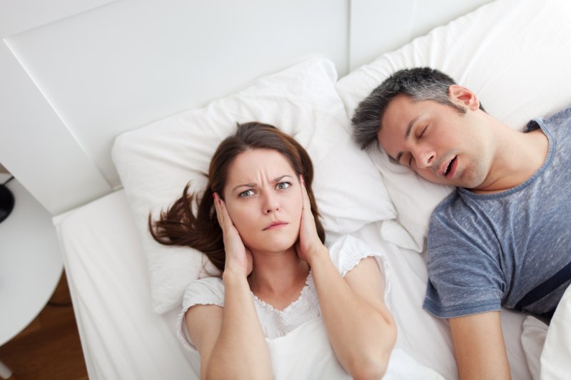 wife upset with husband for snoring