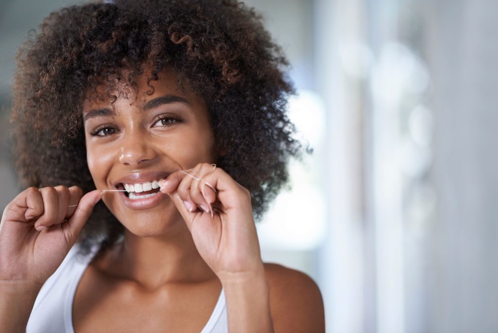 Dentist in Worthington Floss Stuck in Teeth Dr. LJ Adam
