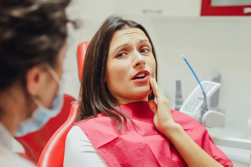 Woman with dental emergency in Worthington