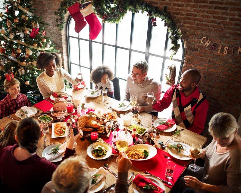 A family enjoying a holiday feast with good dental health