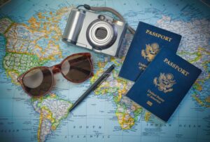 Travel items such as passports, sunglasses, and camera.
