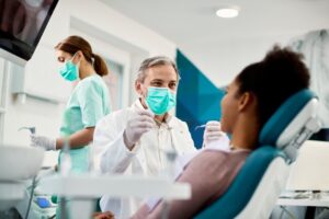 Dentist working on patient.